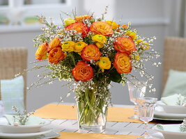 Yellow-orange spring Ranunculus, Rosa 'Circus' bouquet