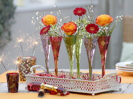 New Year's Eve table decoration with roses and gerbera