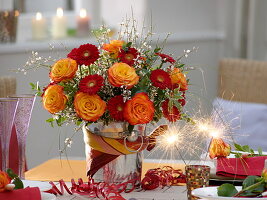 New Year's table decoration with roses and gerberas