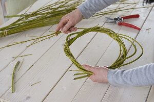 Yellow daffodil bouquet in dogwood branches wreath