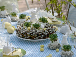 Easter table decoration with cress eggs and pussy willow