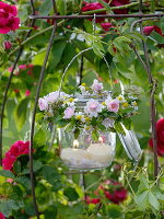 Preserving jar with herb wreaths hung as a lantern