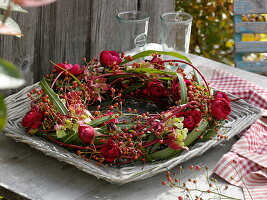 Spiral cornus wreath with leaves of miscanthus