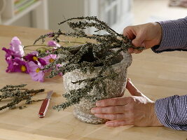 Arrangement with decorative basket and lichen-covered branches (3/5)