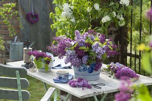 Mixed syringa (lilac) bouquet in salt glaze pot