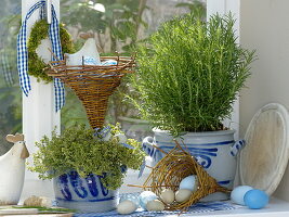 Herbs in the window decorated for Easter