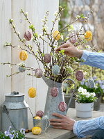 Sticking crushed flowers to easter eggs