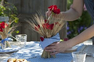 Bavarian table decoration with cereals and geraniums