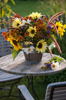 Colourful cottage garden bouquet in wooden pot