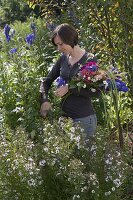 Woman cutting late summer bouquet