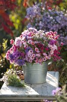 Bouquet made of mixed aster (white wood aster) in zinc buckets