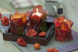 Glasses as lanterns with red leaves of strawberries