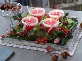 Natural Advent wreath with candle glasses, moss, Ilex branches