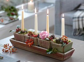 Natural candle decoration with Malus (ornamental apples), Rosa (rose, rosehips)