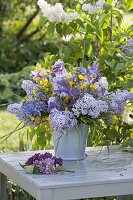 Purple-yellow spring fragrance bouquet: Syringa (lilac), Aquilegia