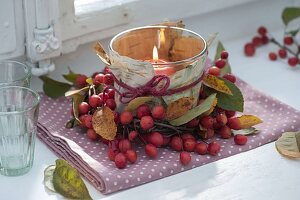 Lantern with birch bark and ornamental apples