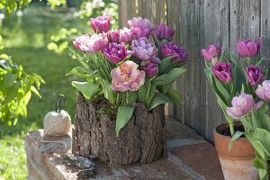 Plastic box covered with bark as a planter box