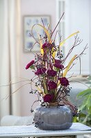 Standing bouquet with branches of Cornus (dogwood), Dianthus (carnations)