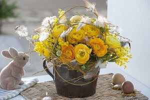 Yellow scented bouquet of Ranunculus (ranunculus), Acacia (mimosa)