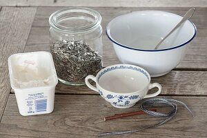 Birdseed in different containers to hang up