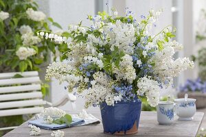 White-blue bouquet in hand-made ceramic syringa