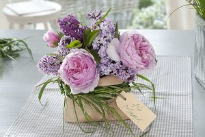 Small bouquet of roses and syringa with cuff