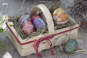 Dyeing eggs with wax reservation technique