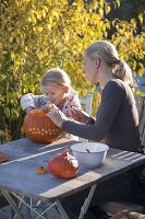 Pumpkins carve with children