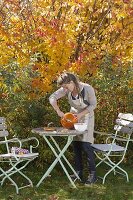 Hollowing out pumpkin for floristry