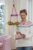 Hanging wreath as Christmas tree and advent calendar