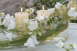 Elongated glass bowl as lantern with campanula (bellflower)