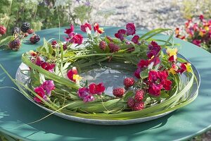 Grass wreath of Miscanthus decorated with Antirrhinum