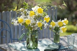 Yellow-white spring bouquets of narcissus (narcissus) and twigs