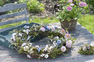 Wicker wreath with spring flowers