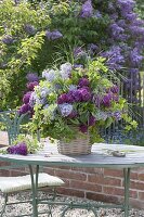 Bouquet of syringa, branches of Rose, akebia