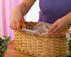 Basket with crocus, daffodils, hyacinths, tulips, puschkinia