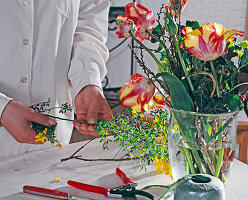 Tulips, cytisus and viburnum bouquet binding