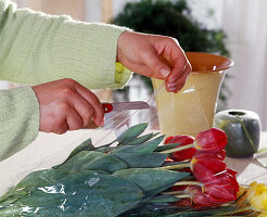 Immediately remove the bouquet of tulips from the foil