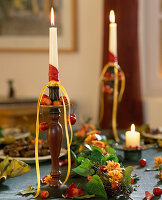 Autumnal table decoration: candle holder decorated with Malus (ornamental apples)