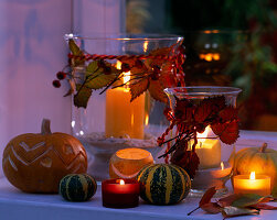 Pumpkin decoration in the window: Cucurbita (pumpkins), Rosa (rosehips), Rubus (blackberry blossoms)