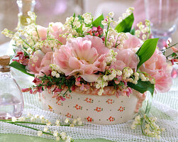 Arrangement of tulips Angelique and lily of the valley in a bowl