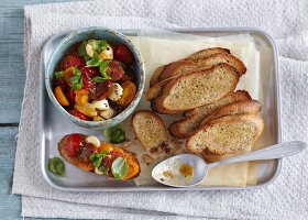 Bruschetta with tomato compote and mini mozzarella balls