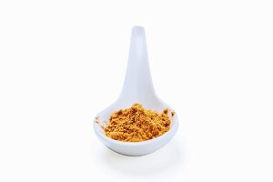 Moroccan spice mixture ras el hanout on a spoon