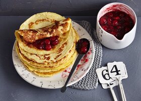 A stack of crêpes with sour cherry ragout