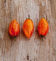 Homegrown cherry tomatoes on old wood surface