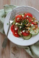 Cucumber and melon carpaccio with pine nuts