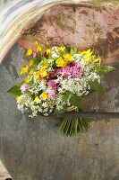 Bouquet of white cow parsley, red campion and yellow buttercups