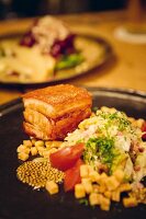 Pork belly and pointed cabbage served at the 'Metzger und Marie' restaurant in Cologne, Germany