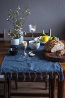 Breakfast table with bread, egg and lemons