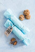 Two rolls of gift-wrapped biscuits